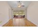 Bright room boasts of wood floors and access to screened patio at 6755 Approach Rd # 31, Sarasota, FL 34238