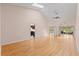 Spacious living room with vaulted ceilings, skylights, and wood flooring at 6755 Approach Rd # 31, Sarasota, FL 34238