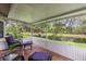 Relaxing covered patio with comfortable seating and serene water views at 6755 Approach Rd # 31, Sarasota, FL 34238