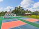 Active community featuring well-maintained tennis courts for recreational enjoyment, surrounded by lush landscaping and amenities at 6755 Approach Rd # 31, Sarasota, FL 34238