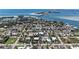 Gorgeous aerial view of a quaint island community with lush landscaping and beautiful beaches nearby at 681 Fox St, Longboat Key, FL 34228