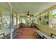 Inviting lanai with tiled flooring, ceiling fan, and comfortable seating at 681 Fox St, Longboat Key, FL 34228