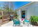Outdoor patio with seating area, grill, and access to the interior at 681 Fox St, Longboat Key, FL 34228