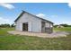 Well-kept barn with sliding doors and ample space, ideal for animals or storage on a lush green property at 6875 Myakka Valley Trl, Sarasota, FL 34241