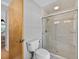 Bright bathroom features a walk-in shower with glass door at 6875 Myakka Valley Trl, Sarasota, FL 34241