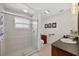 Well-lit bathroom with a sleek glass-enclosed shower and modern fixtures at 6875 Myakka Valley Trl, Sarasota, FL 34241