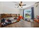 Charming bedroom featuring a bunk bed and a view of the outdoors at 6875 Myakka Valley Trl, Sarasota, FL 34241