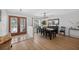Dining room with wood flooring and decorative front doors at 6875 Myakka Valley Trl, Sarasota, FL 34241