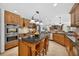 Spacious kitchen featuring an island with counter seating and stainless steel appliances at 6875 Myakka Valley Trl, Sarasota, FL 34241