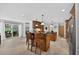 Open kitchen with a large central island and bar stool seating, perfect for Gathering dining and entertaining at 6875 Myakka Valley Trl, Sarasota, FL 34241