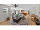 Open-concept living room seamlessly connected to the dining and kitchen areas, perfect for modern living at 6875 Myakka Valley Trl, Sarasota, FL 34241