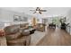 Bright living room with hardwood floors and comfortable seating arrangement at 6875 Myakka Valley Trl, Sarasota, FL 34241