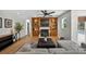 Inviting living room with custom built-ins, featuring a fireplace, tv, and plush furniture at 6875 Myakka Valley Trl, Sarasota, FL 34241
