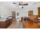 Spacious office with built-in cabinets and view towards backyard pool area at 6875 Myakka Valley Trl, Sarasota, FL 34241