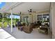 Inviting covered patio with comfortable seating and ceiling fans at 6875 Myakka Valley Trl, Sarasota, FL 34241