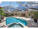 Backyard pool and patio area with lush tropical foliage at 6875 Myakka Valley Trl, Sarasota, FL 34241