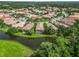 Aerial view of homes with screened in patios overlooking a pond at 7343 Birds Eye Ter, Bradenton, FL 34203