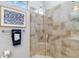 Modern bathroom features a glass enclosed shower with tiled walls, and neutral paint at 7343 Birds Eye Ter, Bradenton, FL 34203