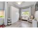 Bedroom bedroom with crib, closet system, neutral decor and natural light at 7343 Birds Eye Ter, Bradenton, FL 34203