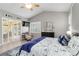 Comfortable bedroom features a vaulted ceiling and a cozy sitting area with lots of natural light at 7343 Birds Eye Ter, Bradenton, FL 34203