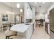 Bright, spacious kitchen features quartz countertops, stainless steel appliances, and a breakfast bar that complements the dining area at 7343 Birds Eye Ter, Bradenton, FL 34203