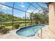 Gorgeous pool with water features, surrounded by lush landscaping and an amazing lake view at 7343 Birds Eye Ter, Bradenton, FL 34203