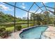 Inviting pool area with a picturesque lake view, perfect for relaxation and entertaining at 7343 Birds Eye Ter, Bradenton, FL 34203