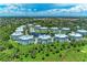 Aerial view of the community showcasing the picturesque neighborhood and community pool at 7820 34Th W Ave # 102, Bradenton, FL 34209