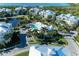 Aerial view showcasing the community layout, complete with a pool, pond, and lush landscaping at 7820 34Th W Ave # 102, Bradenton, FL 34209