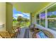 Balcony featuring outdoor furniture and a view of green space in the home at 7820 34Th W Ave # 102, Bradenton, FL 34209