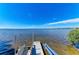 Bay view of dock featuring a boat lift to make boating easier at 7820 34Th W Ave # 102, Bradenton, FL 34209