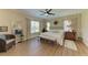 Spacious primary bedroom featuring a ceiling fan, decorative accents, and natural light showcases comfort and style at 7820 34Th W Ave # 102, Bradenton, FL 34209