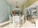 Outdoor dining area with seating, a large stainless steel grill, and covered space for gatherings at 7820 34Th W Ave # 102, Bradenton, FL 34209