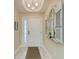 Bright condo entryway featuring tiled floors, decorative accents and natural light from the sidelight at 7820 34Th W Ave # 102, Bradenton, FL 34209