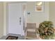 Inviting condo entryway with a well-lit porch, a seating area and a view of unit number 102 at 7820 34Th W Ave # 102, Bradenton, FL 34209