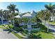 Exterior of the residences surrounded by palm trees, grass and sidewalks in a community at 7820 34Th W Ave # 102, Bradenton, FL 34209