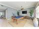 Community game room with billiard table, TV, comfortable seating, and tasteful decor at 7820 34Th W Ave # 102, Bradenton, FL 34209