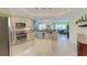 Bright kitchen with stainless steel appliances, granite countertops, and a center island perfect for cooking at 7820 34Th W Ave # 102, Bradenton, FL 34209