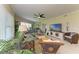 Spacious living room with large windows, ceiling fan, comfortable seating, and access to outdoor areas at 7820 34Th W Ave # 102, Bradenton, FL 34209