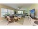 Comfortable living room with ceiling fan, tile floors, ample seating, and natural light at 7820 34Th W Ave # 102, Bradenton, FL 34209