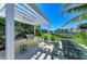 Outdoor grill area with picnic seating and a view of the pond at 7820 34Th W Ave # 102, Bradenton, FL 34209