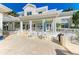 Expansive patio area with multiple seating arrangements, ideal for outdoor relaxation and entertainment at 7820 34Th W Ave # 102, Bradenton, FL 34209