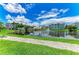 Tranquil pond surrounded by lush landscaping and well-maintained buildings at 7820 34Th W Ave # 102, Bradenton, FL 34209