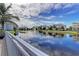 Scenic view of a tranquil pond reflecting the surrounding community buildings and blue sky at 7820 34Th W Ave # 102, Bradenton, FL 34209