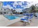 Resort-style pool area with ample lounge seating, palm trees, and a relaxing atmosphere at 7820 34Th W Ave # 102, Bradenton, FL 34209