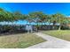 Private resident sunset deck with fence and lush surrounding landscaping at 7820 34Th W Ave # 102, Bradenton, FL 34209