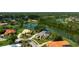 Aerial view of home showcasing well manicured landscaping, a large pool and an expansive lake view at 8312 Misty Lake Cir, Sarasota, FL 34241