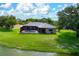 Enjoy this home's outdoor space with screened in pool, large yard and relaxing lake views at 8312 Misty Lake Cir, Sarasota, FL 34241