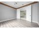 Comfortable bedroom showcasing hardwood flooring, fan, and doors leading to a patio at 8312 Misty Lake Cir, Sarasota, FL 34241