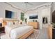 Stylish bedroom showcasing minimalist décor, wood accents and ample closet space at 8312 Misty Lake Cir, Sarasota, FL 34241